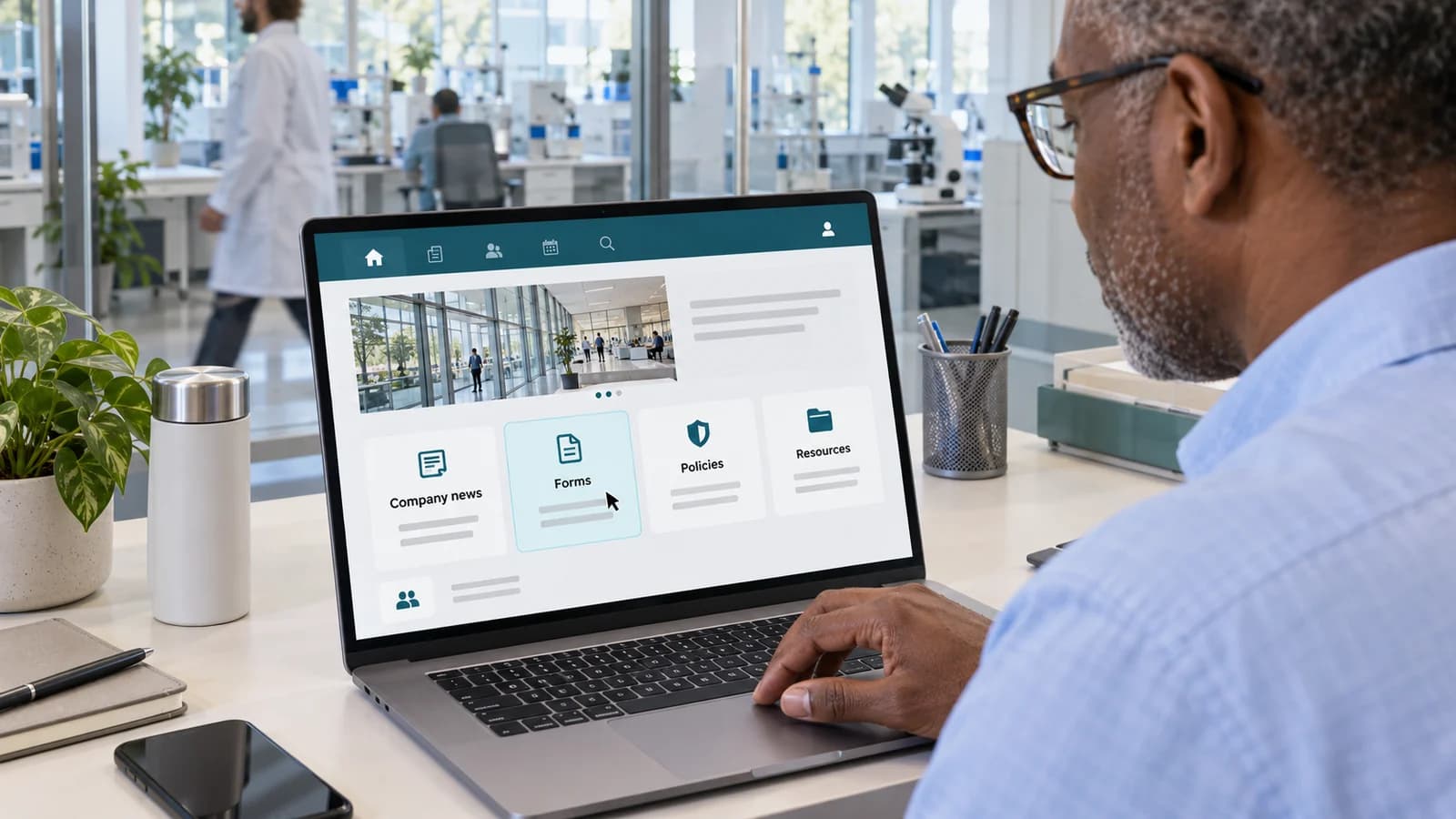 An employee opens a biotech internal communications hub with company news, forms, policies and shared resources.